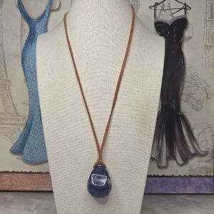 Sodalite teardrop gemstone pendant necklace on a brown leather cord